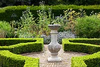 Chilstone Linford Sundial in a formal knot garden in Capel Manor Gardens, London
