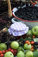Autumn hedgerow fruit and jar of jam