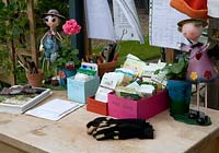 Seeds, guide book and planting plans at greenhouse 'work station' - Bays Farm NGS, Forward Green, Suffolk