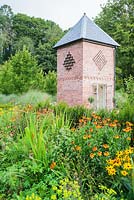 Dovecote, built in 2007, with hot colours of Helenium and Rudbeckias in the foreground - Rhodds Farm, Kington, Herefordshire, UK