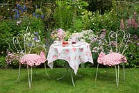 Pretty table set for tea - Garden Neighbours