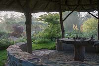 View of garden from thatched African style hut -  Westonbury Mill