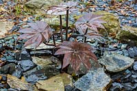 Leaf designed copper, water feature on slate bed 
