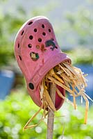 Crocs filled with straw using as a insects attraction