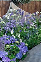Blue and white border with Agapanthus, Delhinium, Hydrangea and salvia. A Day at The Seaside. RHS Tatton Park Flower Show 2013