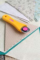Step by step of making garden bunting - Using a triangle template, cutting fabrics with a rotary cutter