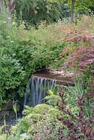 Small cascading waterfall between landscaped lakesGarden -  Little Wantley, Sussex