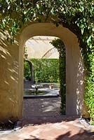 Archway leading from The Dance Garden to The Garden of Troy at the Real Alcazar, Seville, Andalusia, Spain