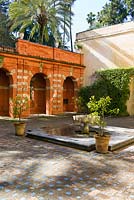 Water fountain in The Garden of Troy at the Real Alcazar, Seville, Andalusia, Spain