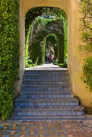 Steps with Azulejos tile decoration leading to The Dance Garden from The Garden of Troy at the Real Alcazar, Seville, Andalusia, Spain
