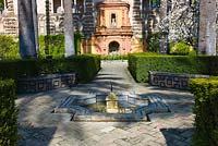 A fountain in The Ladies Garden and the Galer­a del Grutesco at the Real Alcazar, Seville, Andalusia, Spain