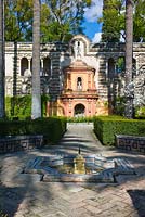A fountain in The Ladies Garden and the Galera del Grutesco at the Real Alcazar, Seville, Andalusia, Spain