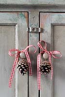 Step by step of making Christmas Doorknob Decorations - Attach to doorknobs by tying a simple bow
