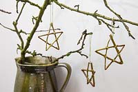 Willow stars hanging from a branch