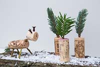 Miniature christmas trees and reindeer made using wine corks