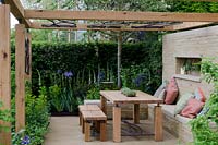 Arbour with seating area,  decorative ironwork by Anwick Forge 