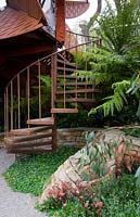 Trailfinders Australian Garden, Chelsea Flower Show 2013. Spiral staircase leading to modern garden studio 