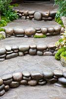 Staircase with pebbles as decorative edging An Alcove Garden. 