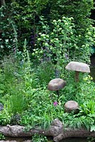 Wooden mushroom sculptures in the Motor Neurone Disease - a Hebridean Weavers Garden