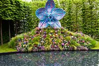 'The Rush of Nature' with orchid sculpture and gnomes painted by various celebrities 