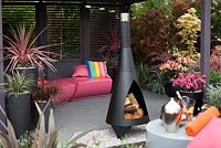 Modern outdoor living area with wood burning chiminea - Hillier Nurseries stand, RHS Chelsea Flower Show 2013