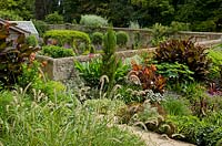 Walled garden with tropical planting 