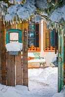 Winter cottage garden - view through open doors