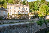 Iford Manor, a Georgian house, sitting in a steep sided valley beside the River Frome. 