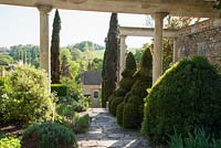 View through colonnades on the Great Terrace to countryside beyond. 