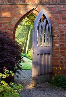 Gothic style wooden gate leading to the Yew walk 