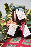 Decorating jars of jam to give as a gift for Christmas - Jars ready with labels