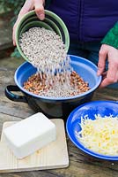 Adding seeds to mixing bowl