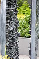 Slate sculpture made by Tom Stogdon. Show Garden: Stop the Spread. 