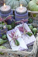 Tray with heather candles and napkins. Calluna vulgaris 'Gina'
