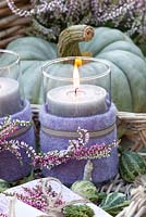 Tray with heather candles and napkins. Calluna vulgaris Madonna, Calluna vulgaris Pink Madonna, Calluna vulgaris Gina