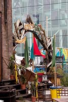 Entrance gate made of recycled material of the ROEST garden in Amsterdam.