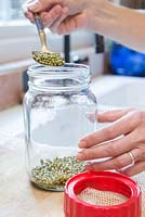 Placing Organic Mung Beans in Glass jar
