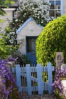 Small garden in Portland, Dorset. Small wooden gate at front
