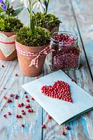 Various valentine gifts and a card decorated with Red Peppercorns