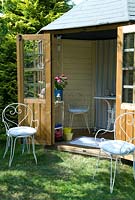 Summerhouse furnished in chic style with metal table and chairs - Open Gardens Day 2013, Benhall, Suffolk