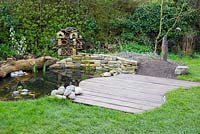 Decking complete and placed beside pond.