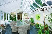 Conservatory with wicker table and chairs 
