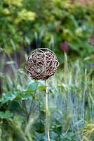 Ornamental garden object made of twisted twigs. Jardin des Pasradis, Cordes-sur-Ciel, Tarn, France.