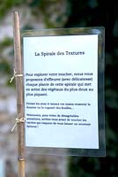Explanations, descriptions and directions displayed throughout the garden. Jardin des Pasradis, Cordes-sur-Ciel, Tarn, France.