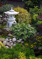 Small pond with Asian stone lantern