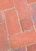 Newly constructed brick path after dried sand has been brushed between cracks in bricks 