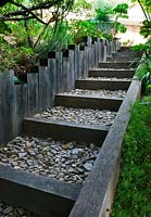 Steps of black woode and stone chippings 