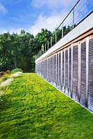 Building with lawn of Zoysia tenuifolia grass. Designer: Jean-Laurent Felizia, France