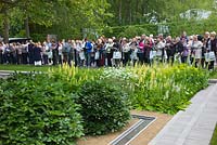 Crowds visiting the RHS Chelsea Flower Show, London. The Laurent-Perrier Garden. Winner of Gold Medal and Best Show Garden.