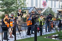 RHS Chelsea Flower Show 2014. The Photographers at one of the show gardens.